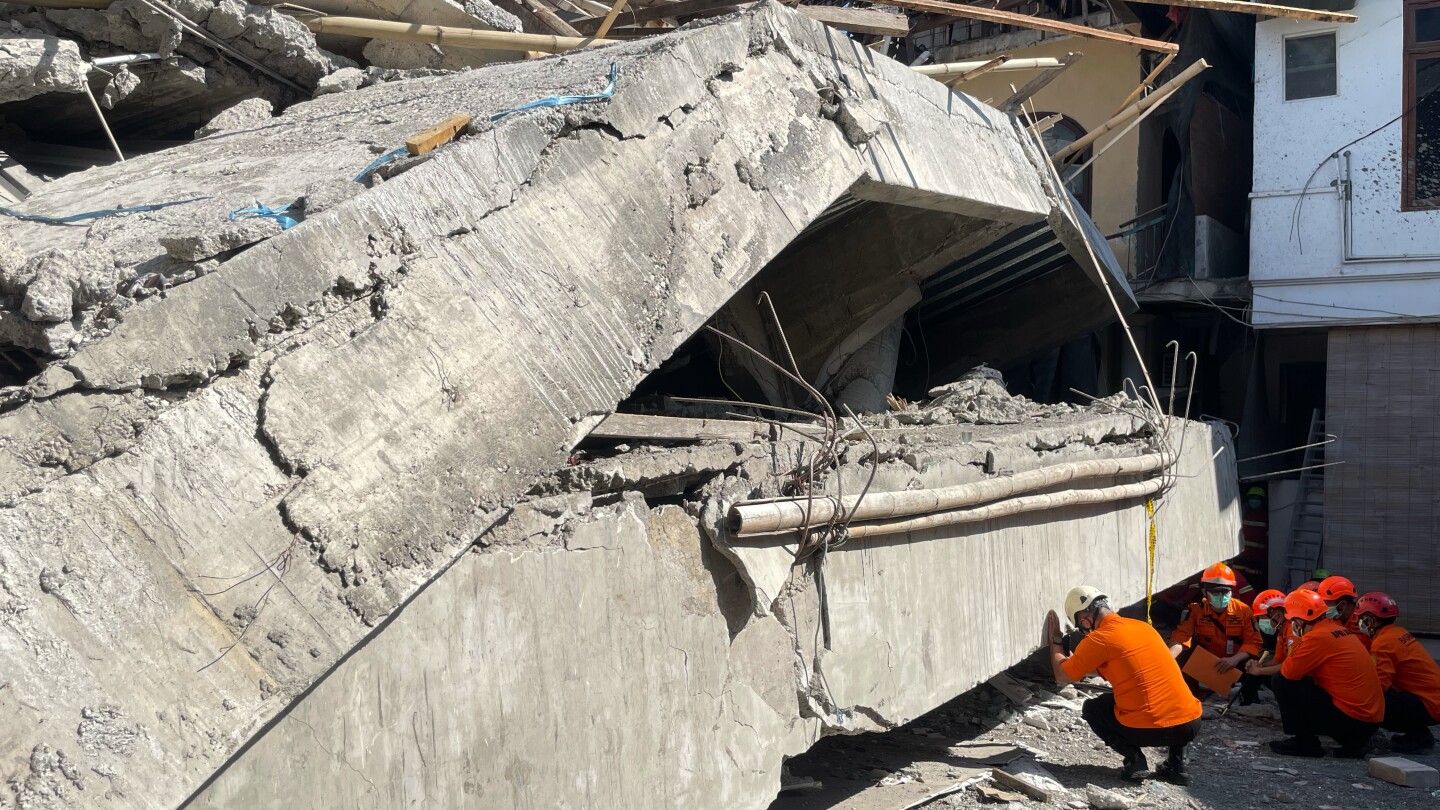 Indonesian rescue workers search for dozens in rubble of collapsed school