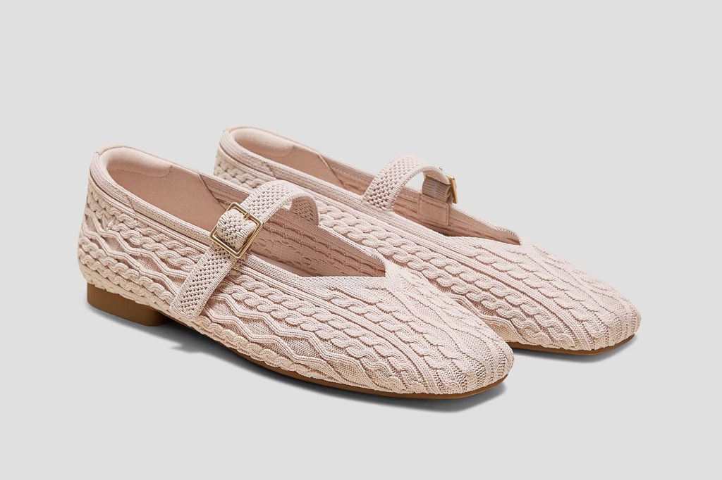 A pair of light pink Mary Jane flats with a knitted cable pattern.