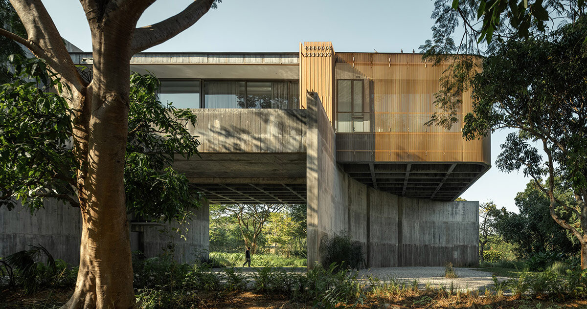 IDIN architects elevates home in thailand to shelter a garden for client's cows