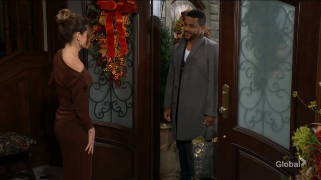 Nate Hastings stands at the door as Victoria Newman answers.