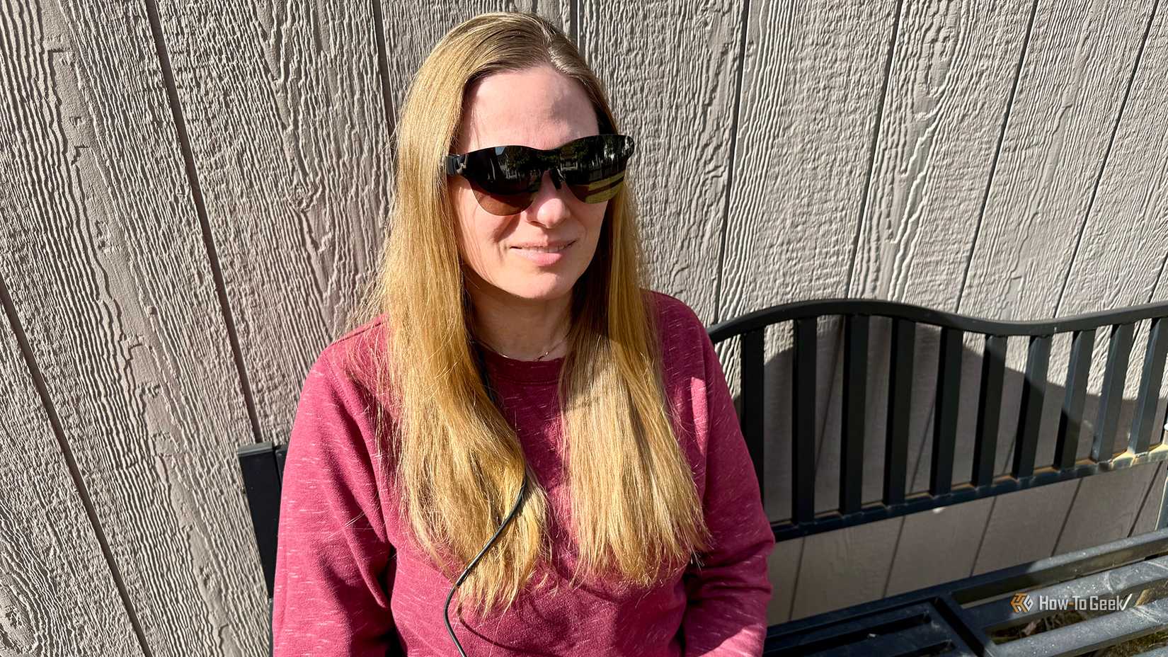 Woman wearing RayNeo Air 3s Pro outdoors.