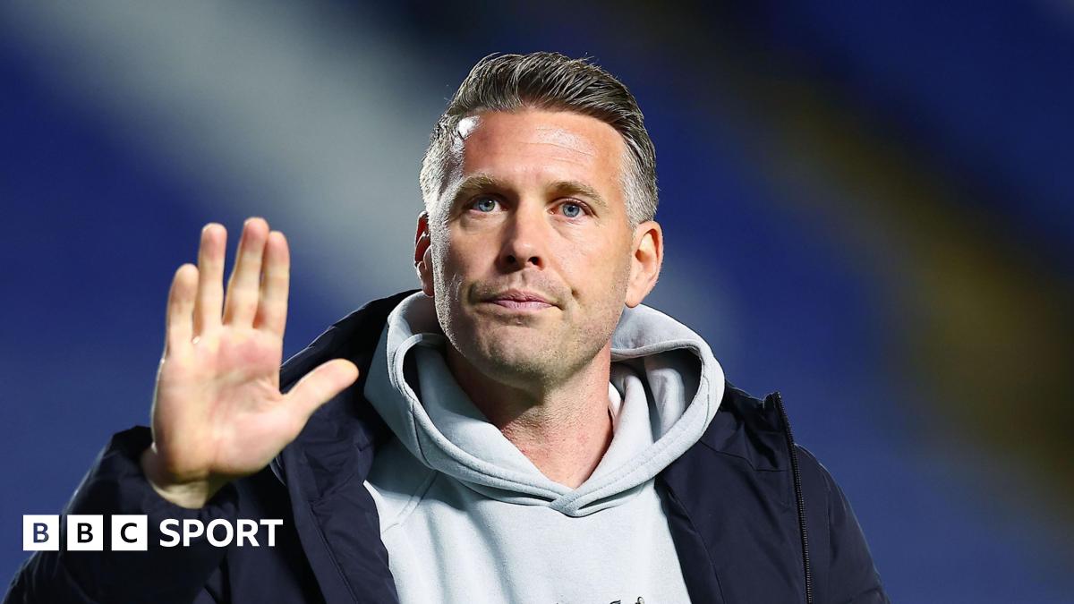 A close-up of former Middlesbrough boss Rob Edwards waving