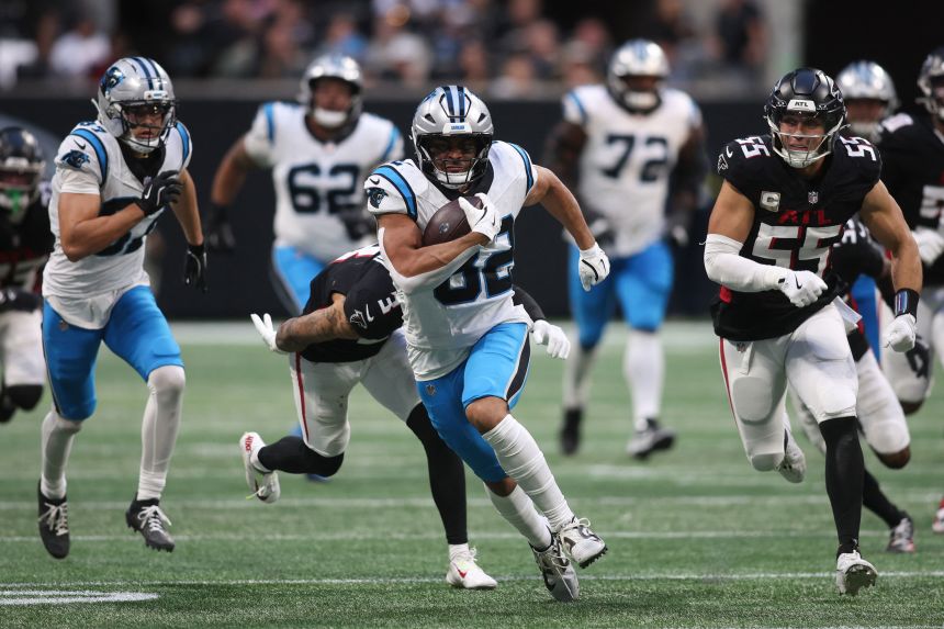 Carolina Panthers tight end Tommy Tremble runs with the ball in OT against the Atlanta Falcons.