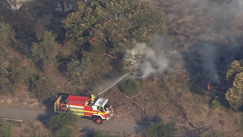 There is a threat to the lives and homes of people in Alfred Cove, Ardross, and Booragoon and Melville as a fire rages through Wireless Hill Park.