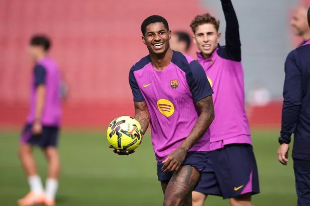 Marcus Rashford smiles in training.