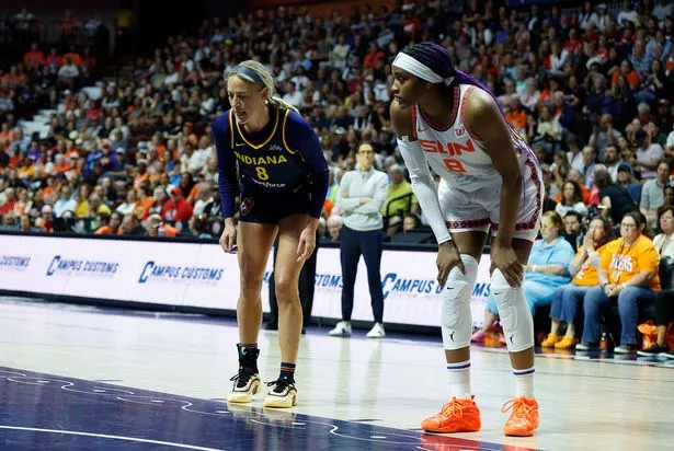 Indiana Fever guard Sophie Cunningham (8) and Connecticut Sun forward Aaliyah Edwards (8) in action during the WNBA game between Indiana Fever and Connecticut Sun on August 17, 2025, at Mohegan Sun Arena in Uncasville, CT.
