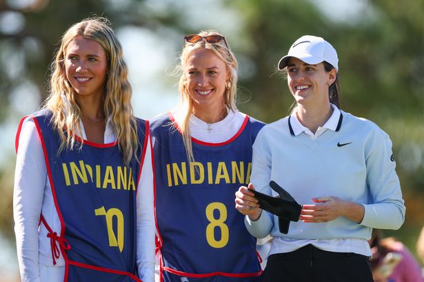 Professional basketball player Caitlin Clark (R) looks on with teammates Lexie Hull and Sophie Cunningham from the 16th tee prior to The ANNIKA driven by Gainbridge at Pelican 2025 at Pelican Golf Club on November 12, 2025 in Belleair, Florida