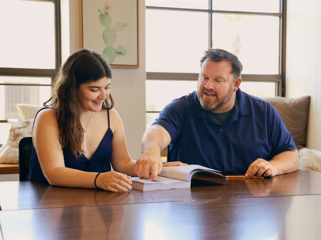 Jonathan Bowman works with a student in the Honors Lounge