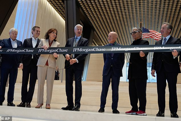 Kathy Hochul is seen next to Dimon, Lord Norman Foster, and Deepak Chopra (second right)
