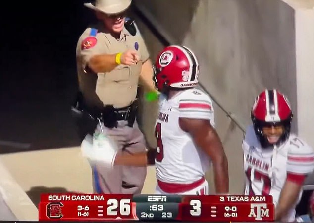 The officer was later relieved of his gameday duties after the brief altercation on Saturday