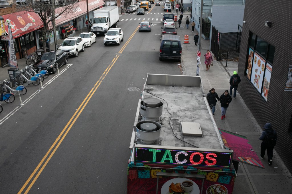 A taco truck sits near the 111th Street station in Corona, Queens.