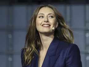 Russian tennis player Maria Sharapova arrives on stage at the Web Summit in Lisbon earlier this month.