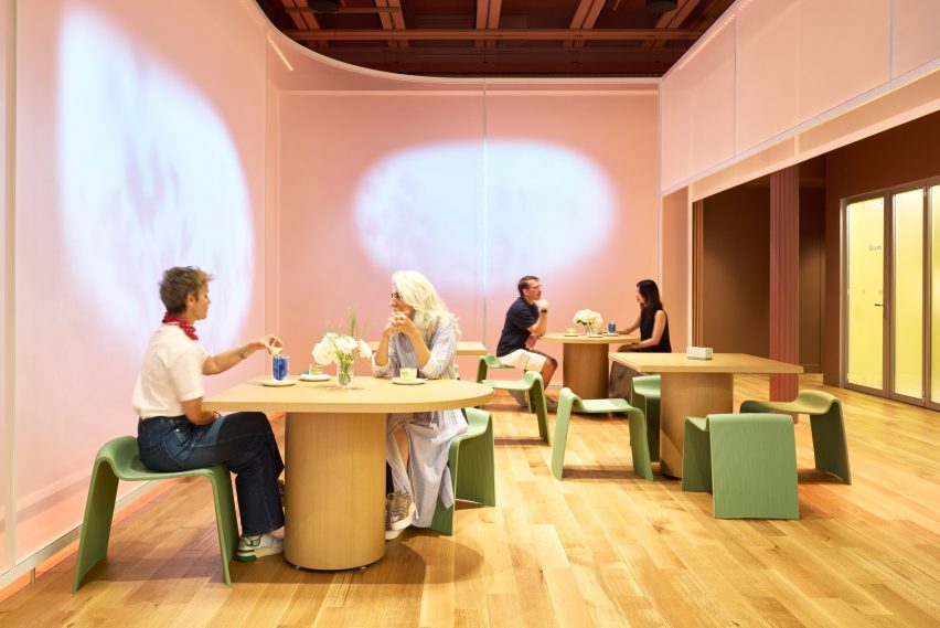 Fabric partitions with digital projections behind a seating area