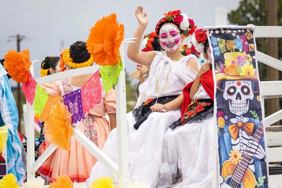 Parade participants ride down Ellis Avenue for the Día De Los Muertos Parade in Northside Fort Worth on Saturday, Nov. 1, 2025.