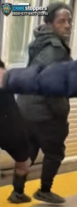 A still from security footage showing a dark-skinned man in a black jacket and black pants, with a "CRIME stoppers" logo overlay.