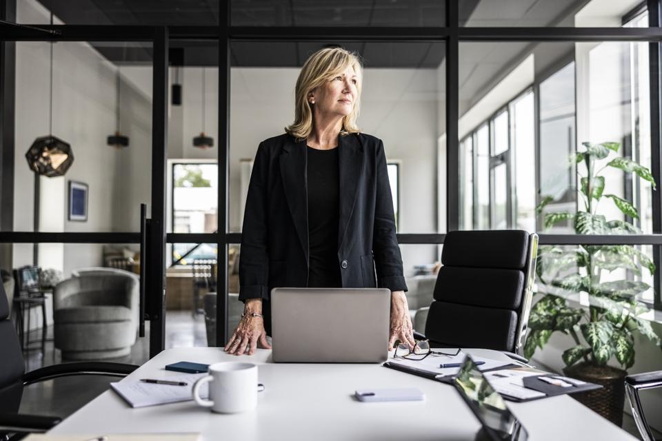 Portrait of businesswoman in modern conference room