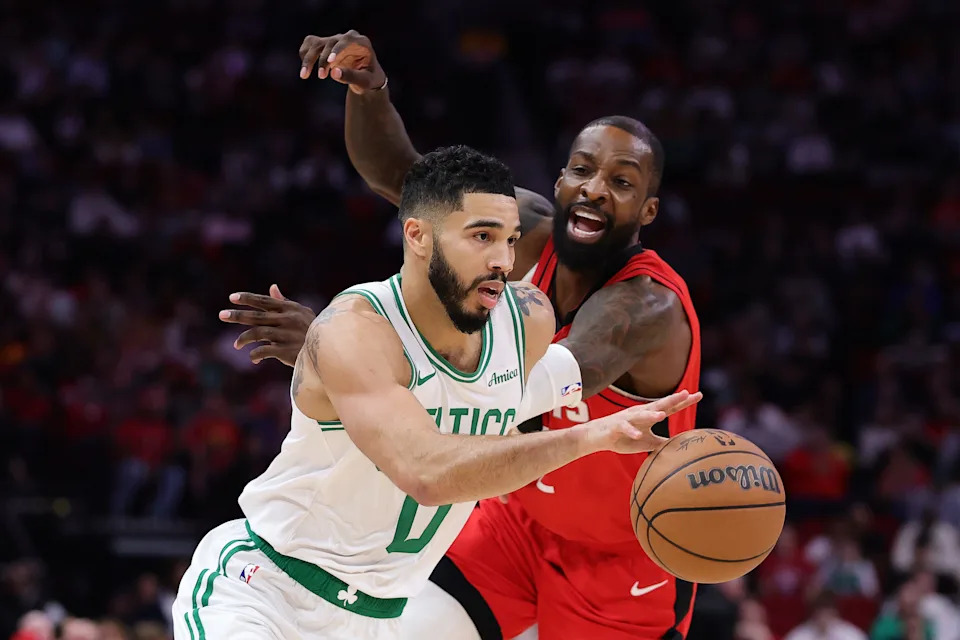 HOUSTON, TEXAS - JANUARY 03: Jayson Tatum #0 of the Boston Celtics drives against Jeff Green #32 of the Houston Rockets during the first half at Toyota Center on January 03, 2025 in Houston, Texas. NOTE TO USER: User expressly acknowledges and agrees that, by downloading and or using this photograph, User is consenting to the terms and conditions of the Getty Images License Agreement. (Photo by Alex Slitz/Getty Images)
