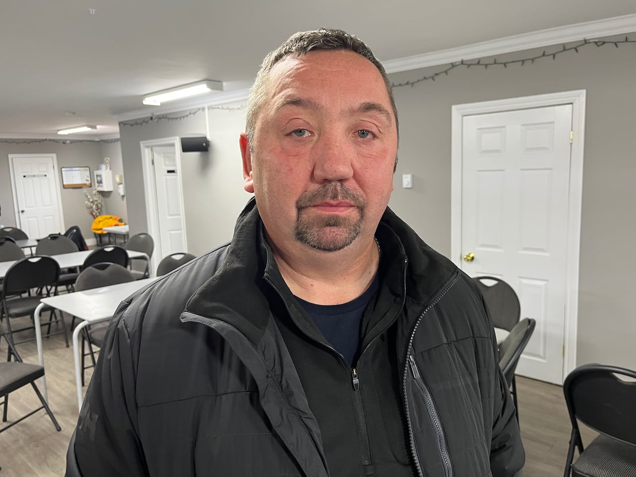 A man wearing a black jacket. 