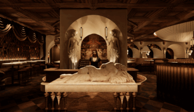 Woman stands behind host stand at Roman God of Fire.