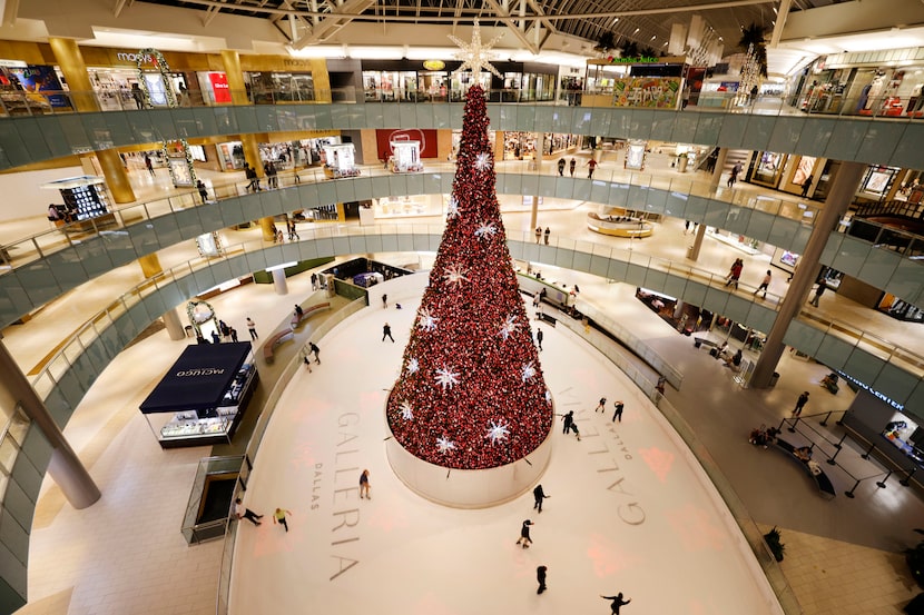 People skate around a Christmas tree at Galleria Dallas Ice Skating Center, Tuesday, Nov....