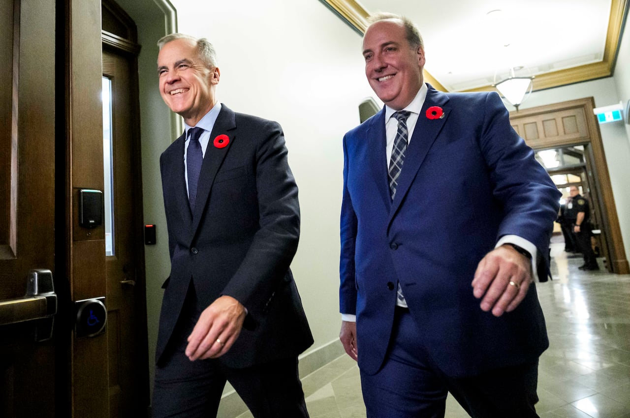 Prime Minister Mark Carney walks with MP Chris d'Entremont, who crossed the floor from Conservative caucus to join the Liberals