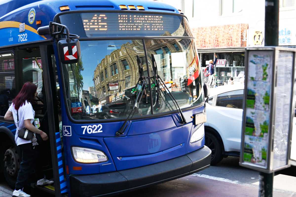people boarding a NYC bus