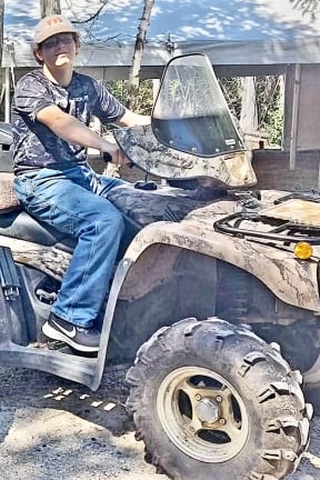 A boy on a four by four