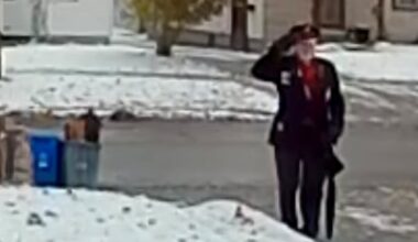 Mystery man caught on camera leaving Canadian flag, saluting outside Kitchener home on Remembrance Day