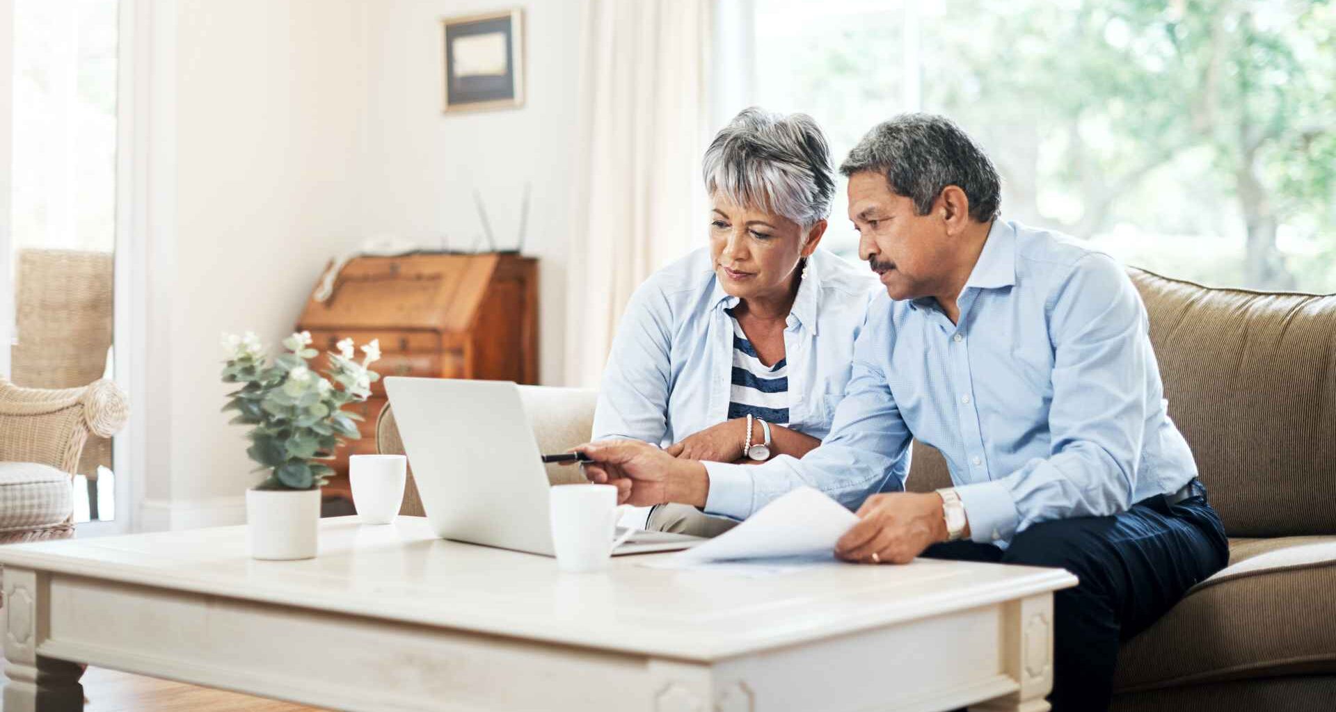 Shot of a senior couple using a laptop together at home.