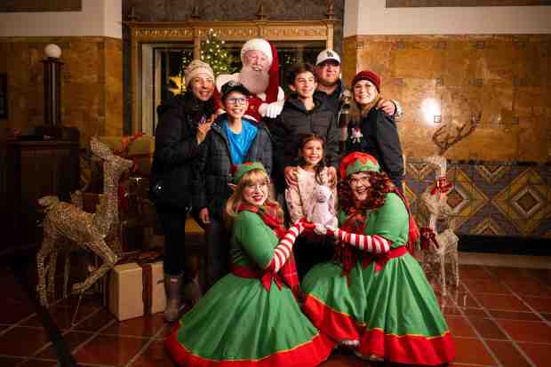 The Mora family, of Mission Hills, get a photo with...