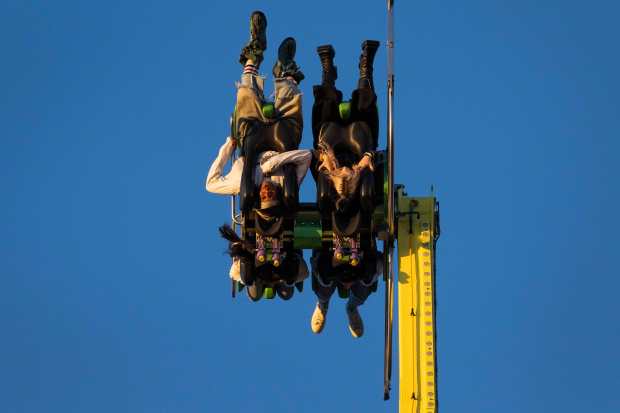Festivalgoers enjoy carnival rides during Day one of the Camp Flog Gnaw...