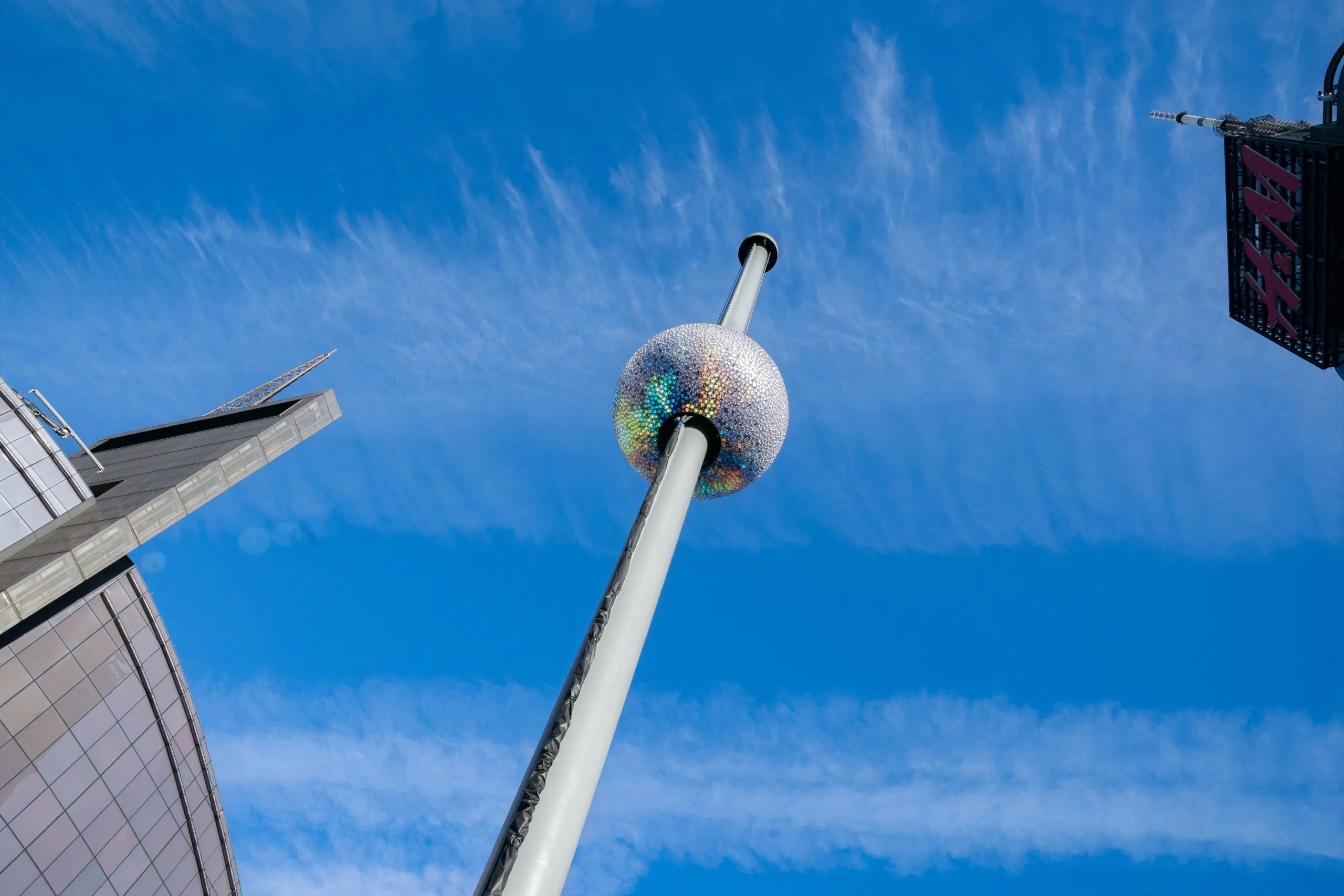 The Times Square Ball 2026 lit up in vibrant colors.