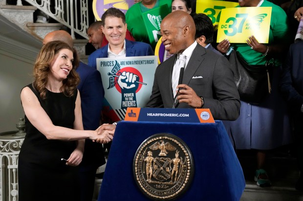 New York City Mayor Eric Adams shakes hands with City Council Member Julie Menin at City Hall on Friday, June. 23, 2023, in New York. (Photo by Charles Sykes/AP Images for Power to the Patients)