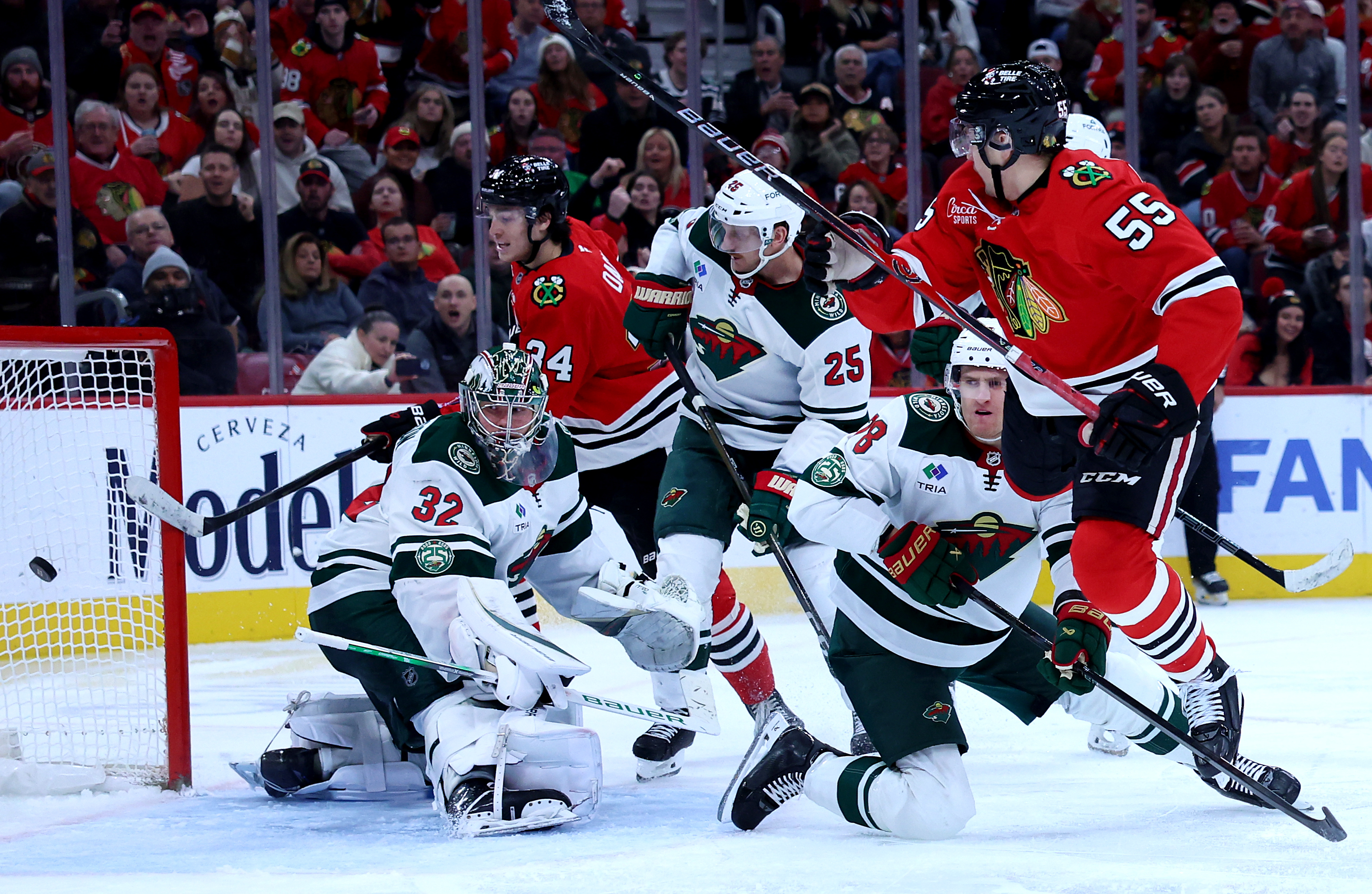 Chicago Blackhawks defenseman Artyom Levshunov (55) scores a goal on Minnesota Wild goaltender Filip Gustavsson (32) in the third period of a game at the United Center in Chicago on Nov. 26, 2025. (Chris Sweda/Chicago Tribune)