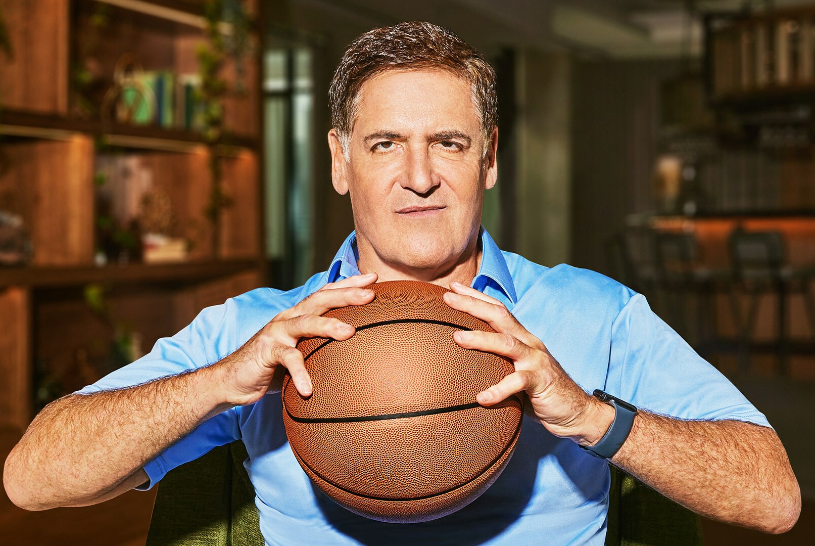 Mark Cuban holding a basketball.