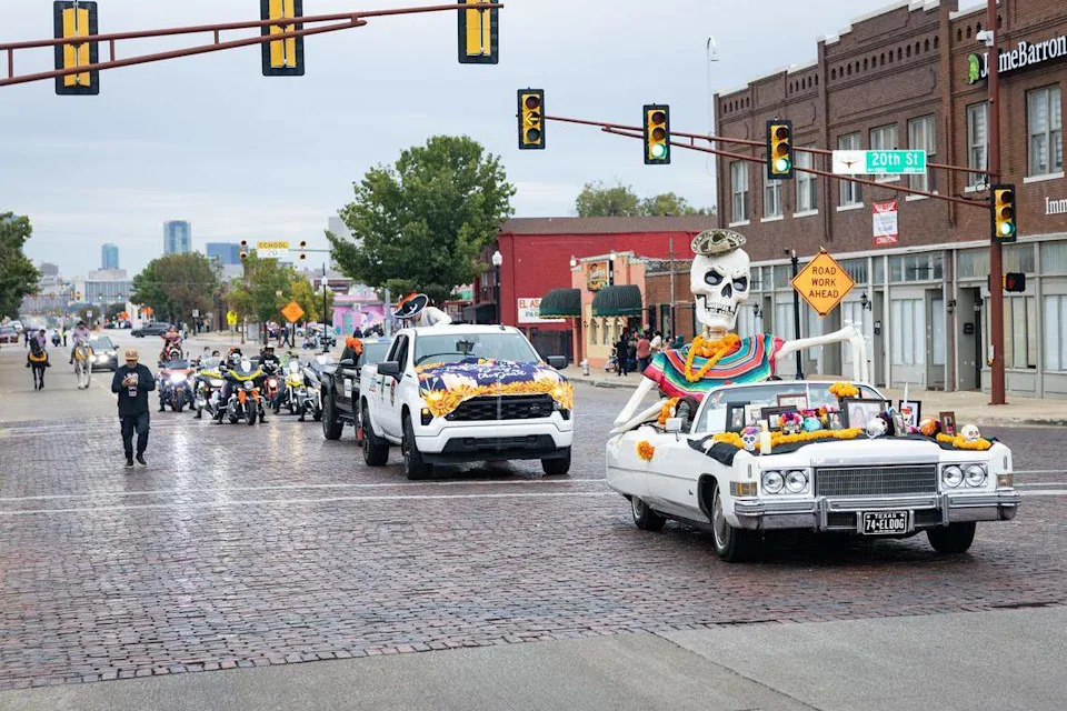 Parade participants ride in their float on Main Street for the Día De Los Muertos Parade in Northside Fort Worth on Saturday, Nov. 1, 2025.