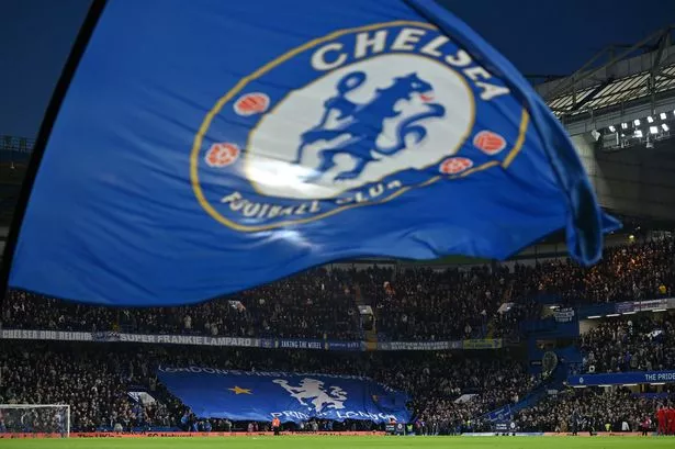 Chelsea flags are waved at Stamford Bridge