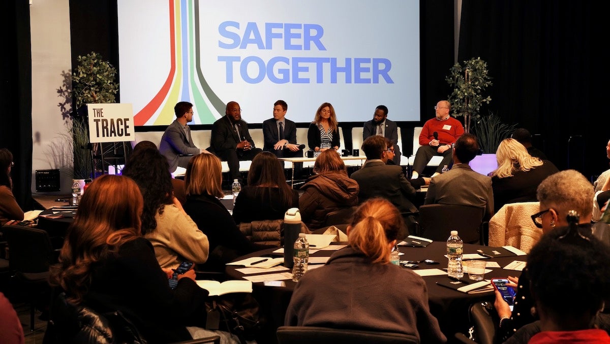 Panelists on stage at the Safer Together forum
