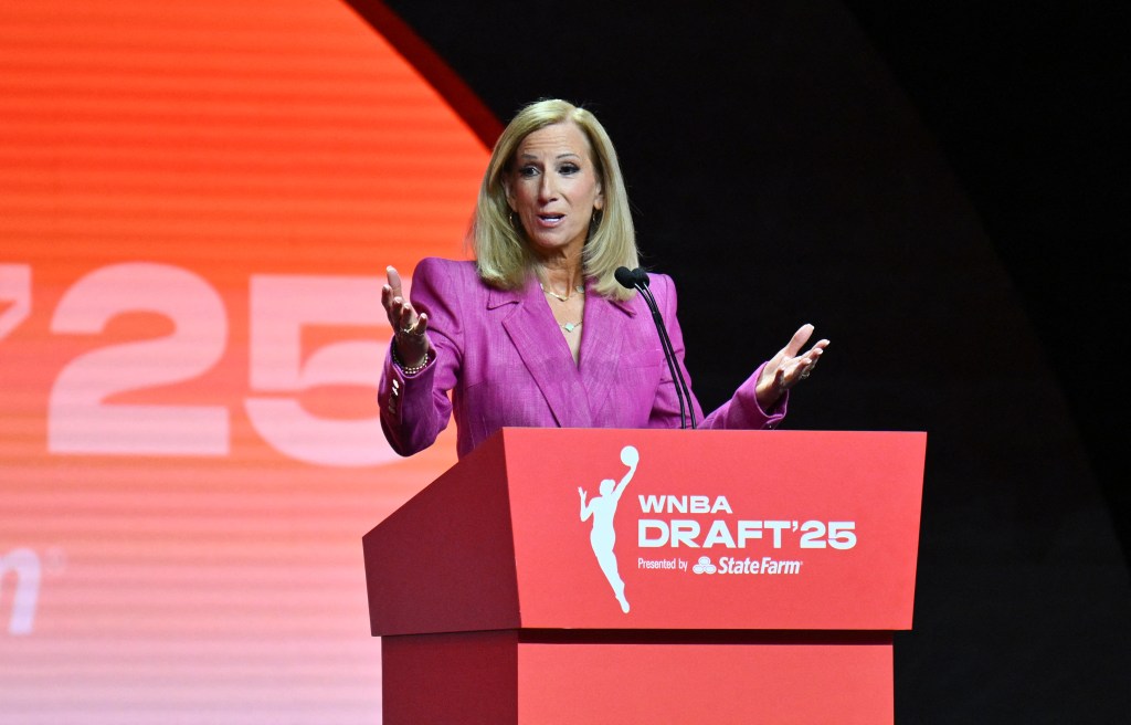 WNBA commissioner Cathy Engelbert speaks at a podium during the 2025 WNBA Draft.