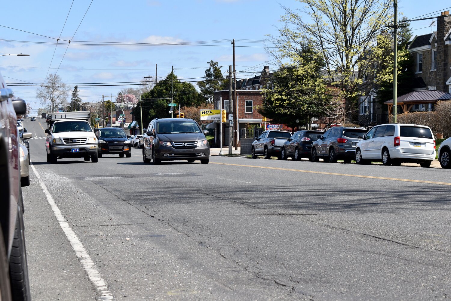 Drivers travel on Castor Avenue in the Oxford Circle neighborhood. A project to redesign the corridor has sparked debate in the area.