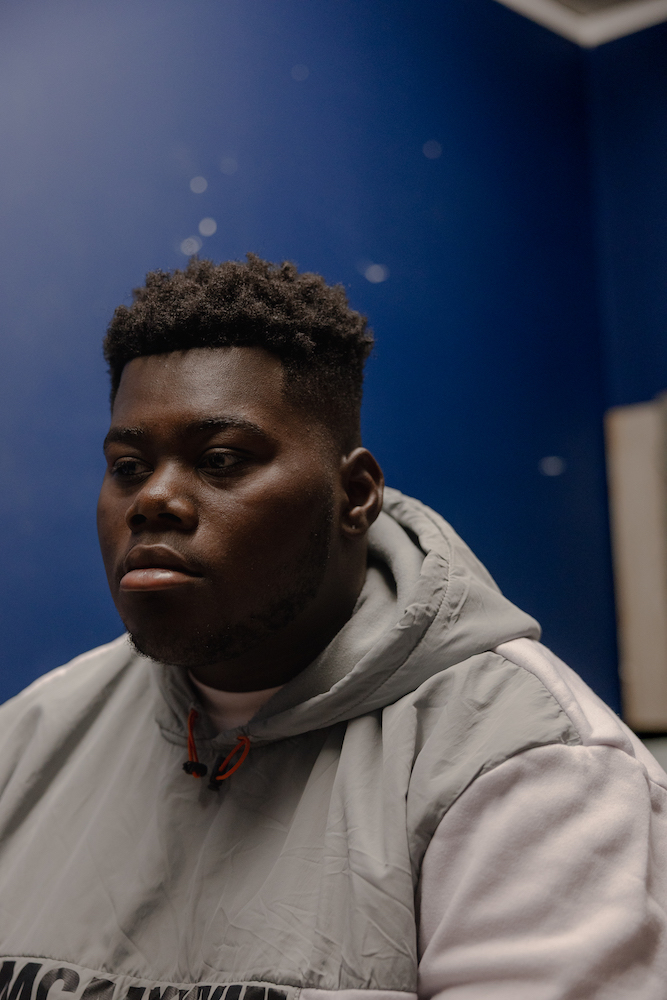 Javohn , “JJ,” Tierra’s son, poses for a portrait in his room at his aunt’s property.