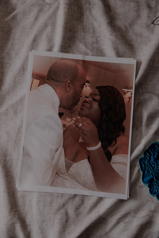 A wedding photo of Tierra La’Nesa Walker and her husband Eric Carson sits on the bed in their home, Sunday, Oct. 5, 2025, in San Antonio.