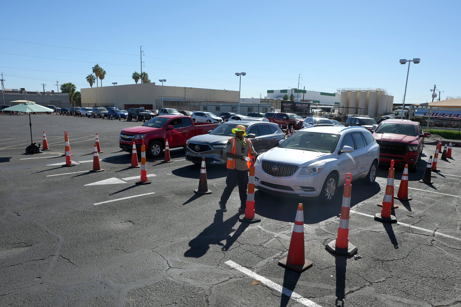 Hundreds of vehicles line up as patrons wait to pick up food at St. Mary