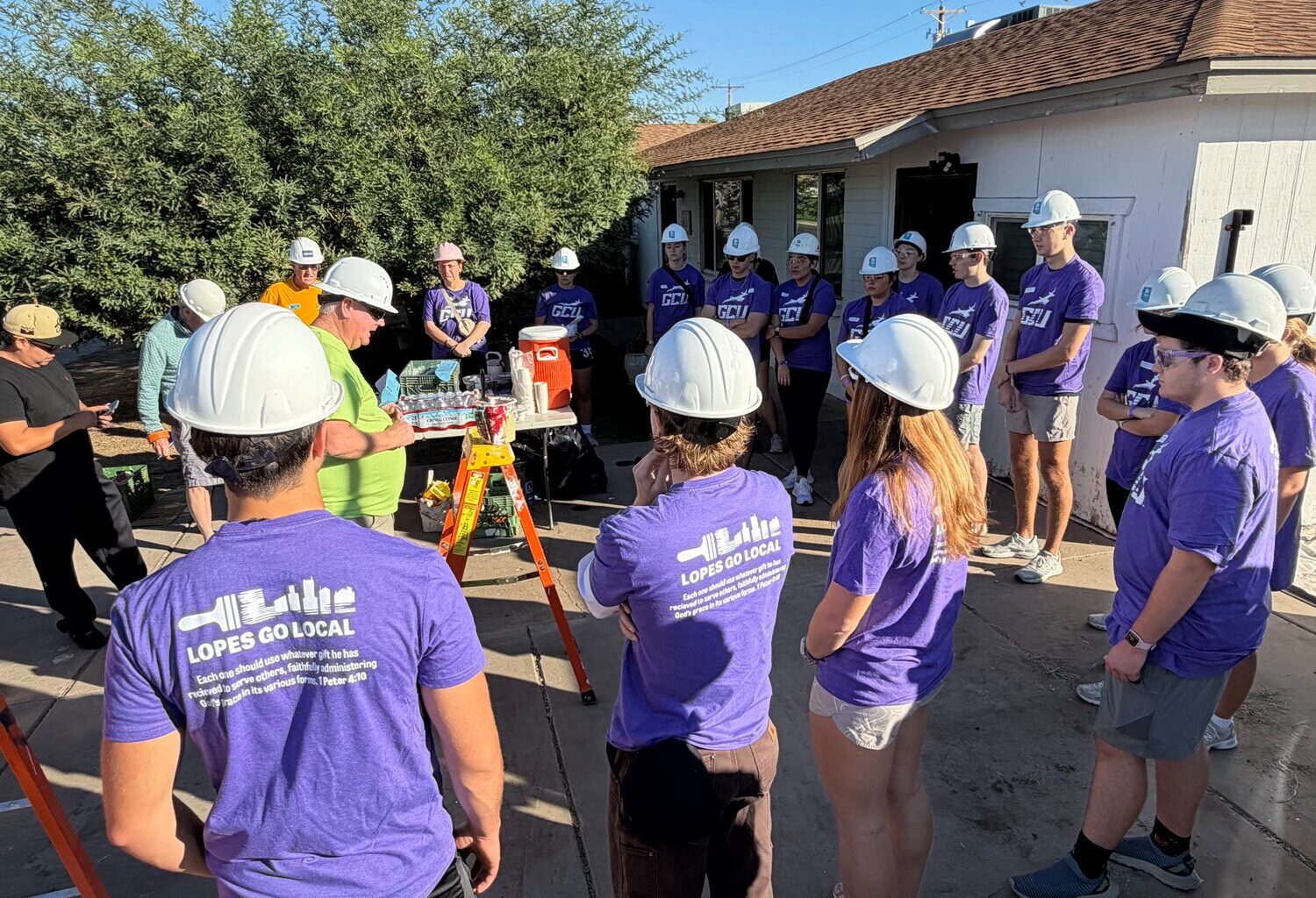 GCU students listen to directions as they begin their Habitat for Humanity project in Phoenix.