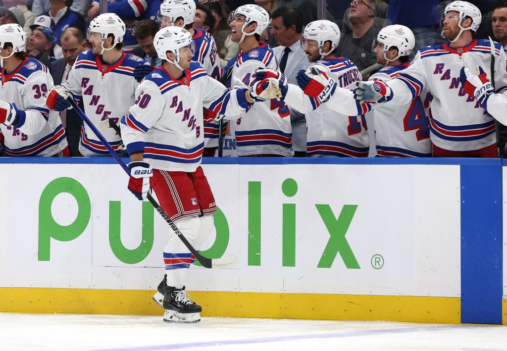 New York Rangers left wing Will Cuylle (50) is congratulated after he scored a goal against the Tampa Bay Lightning during the first period at Benchmark International Arena.