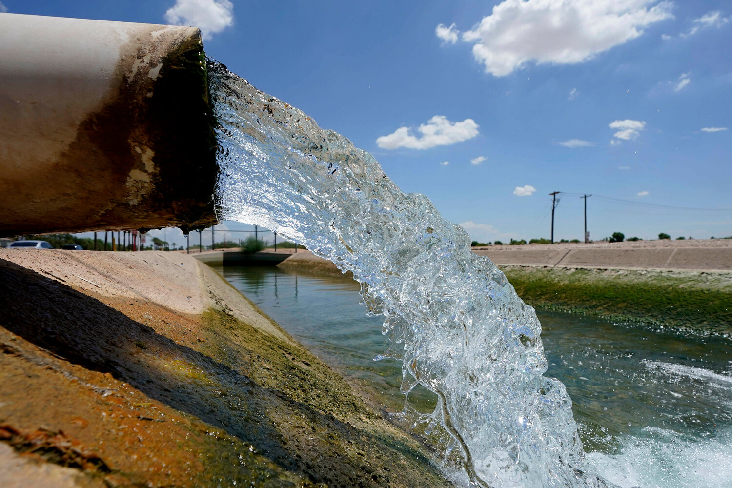 Water from the Colorado River diverted through the Central Arizona Project fills an irrigation canal, Aug. 18, 2022, in Maricopa. The board overseeing the state agency charged with finding new water supplies for Arizona is poised to approve as many as five imported water proposals for startup funding from taxpayers this week, but at least one potential project reignites decades of controversy.