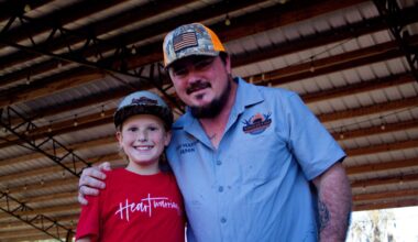 Bryce Bagley, left, and organizer Jason Wheeler take a moment to congratulate each other after their BBQ Ribs and Wings Cookoff raised $11,358 for the Healing Hearts Project.