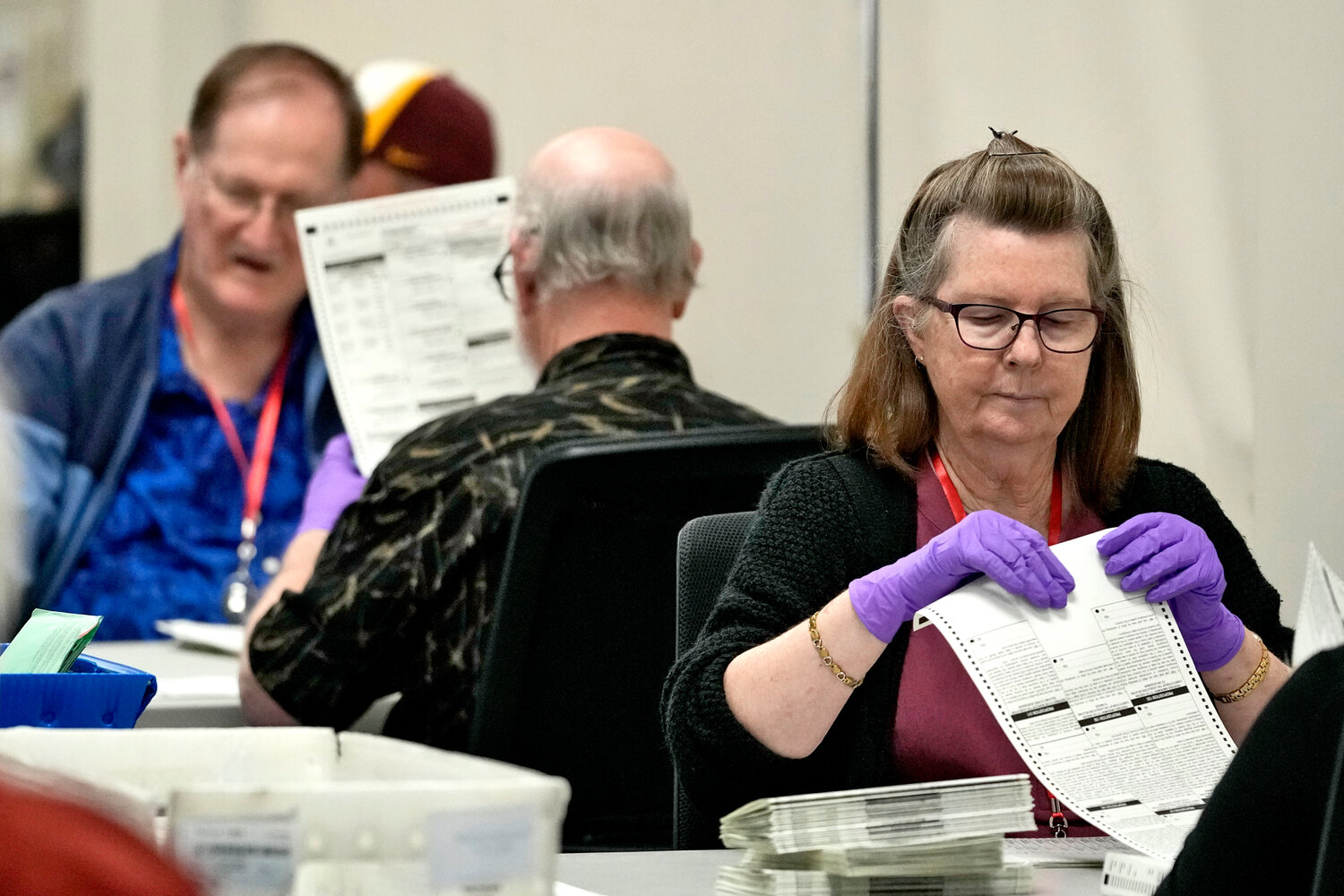 Elections officials process mail-in ballots prior to first day of tabulation in Maricopa County, Wednesday, Oct. 23, 2024, at the Maricopa County Recorder