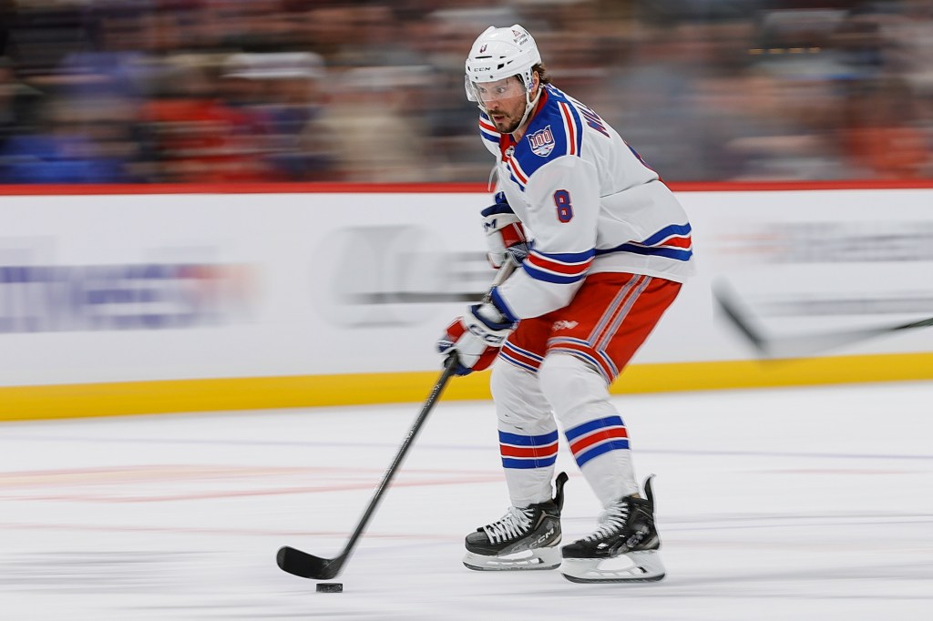 Rangers center J.T. Miller (8) controls the puck in the first period against the Colorado Avalanche at Ball Arena. 