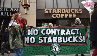 Striking Starbucks workers picket Tuesday, Nov. 25, outside the company